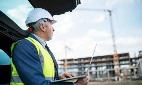 Developer with crane and construction site